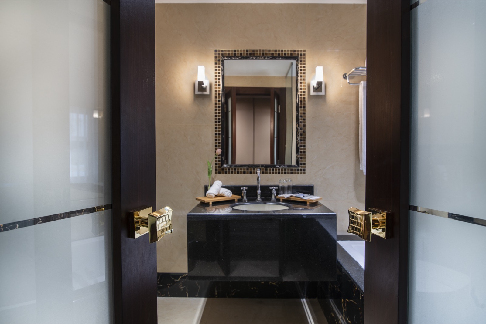 Marble bathroom with a deep bath and rainfall shower
