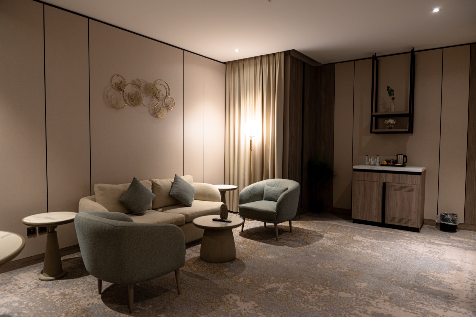 The Junior Suite living room with its own mini-bar